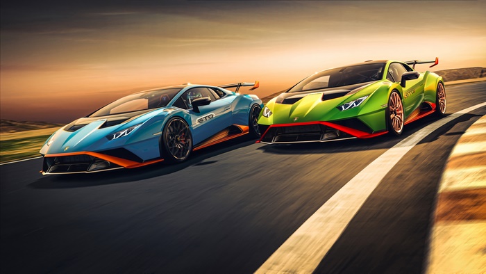 Two Lamborghini Huracan STO cars on a racetrack