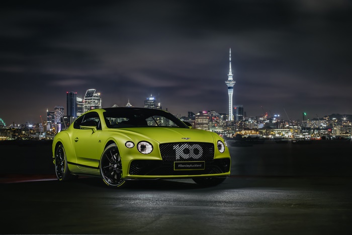 Lime green Bentley Continental GT in Auckland at night