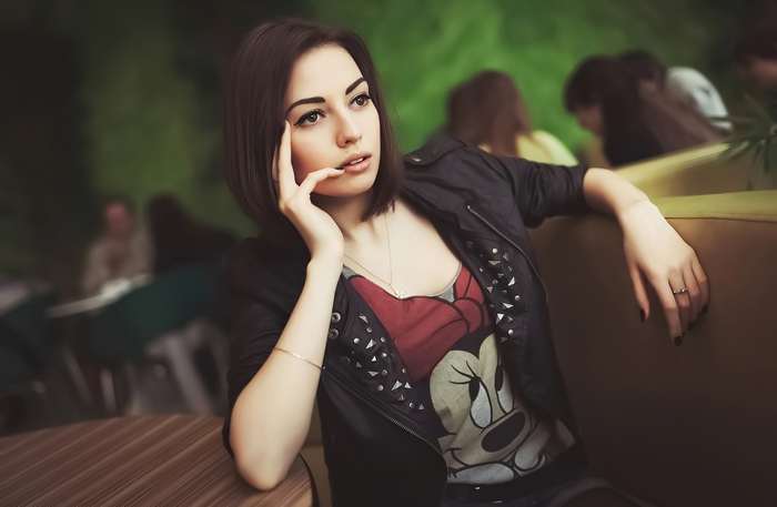 Girl with short dark hair wearing a black jacket