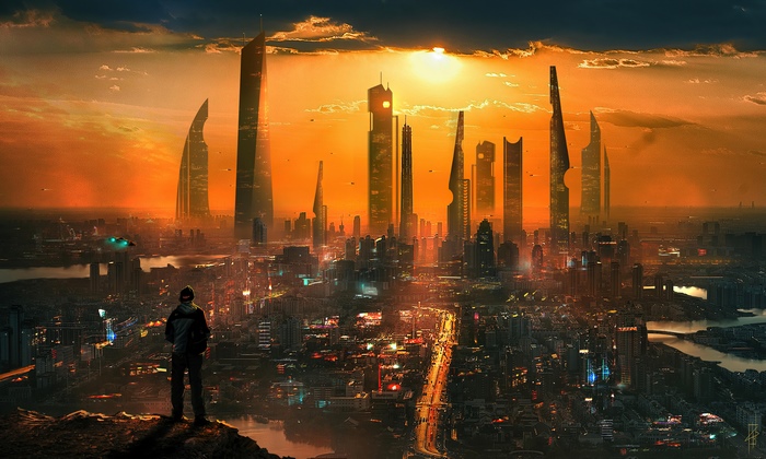 Man overlooking futuristic city at sunset