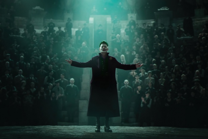 Joker in a dark theater with an audience