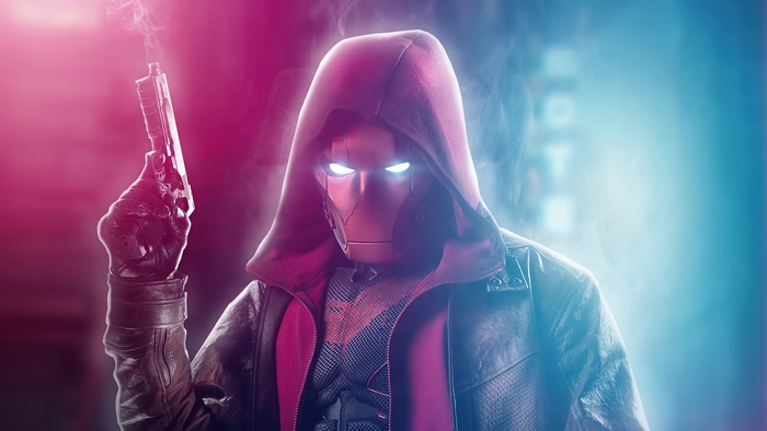 Red Hood from Titans holding a gun