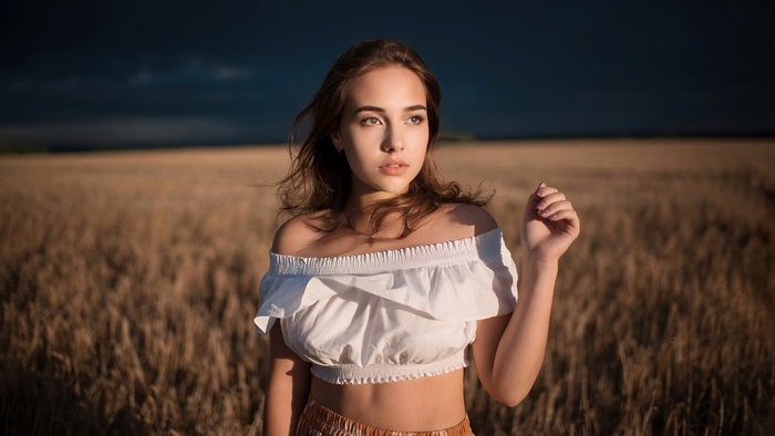 Alina Sabirova in a wheat field