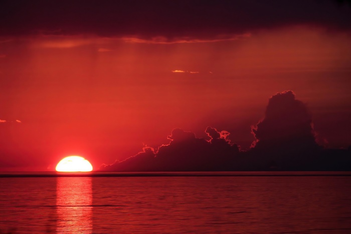 Sunset over a lake with clouds, 4K