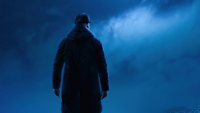 Man in a dark coat looking at the night sky