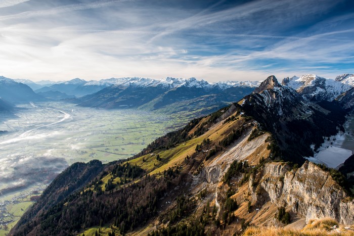Mountain range with valley and snow-capped peaks