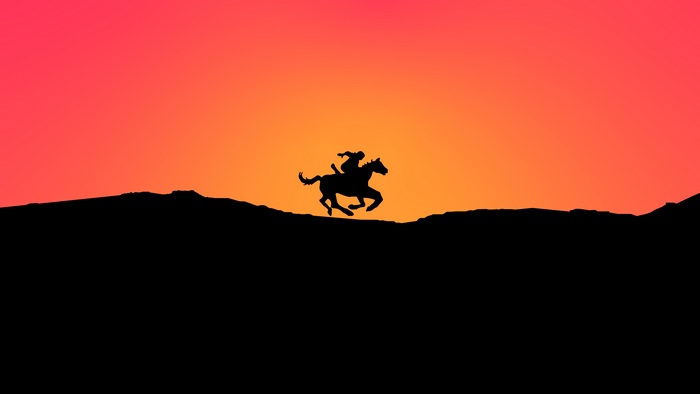 Silhouette of a person riding a horse at sunset