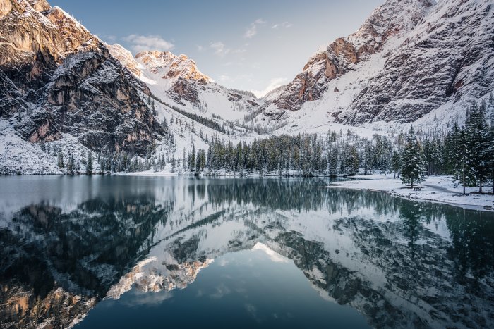 Snowy mountains reflected in a calm lake