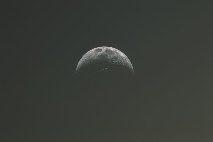 Half Moon with a Satellite Trail