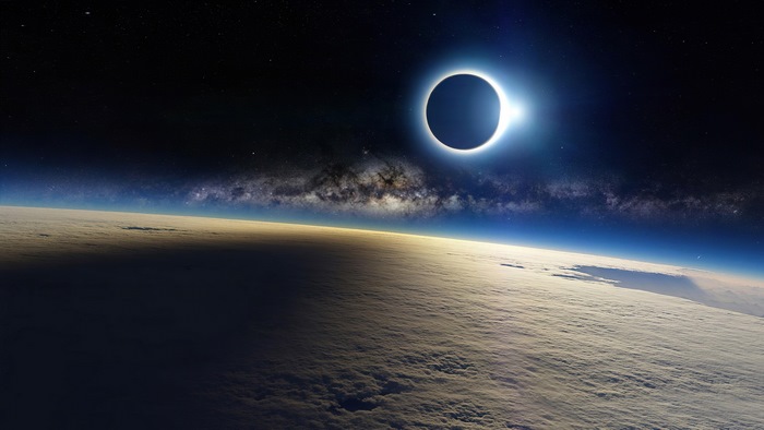 Solar eclipse over Earth with Milky Way
