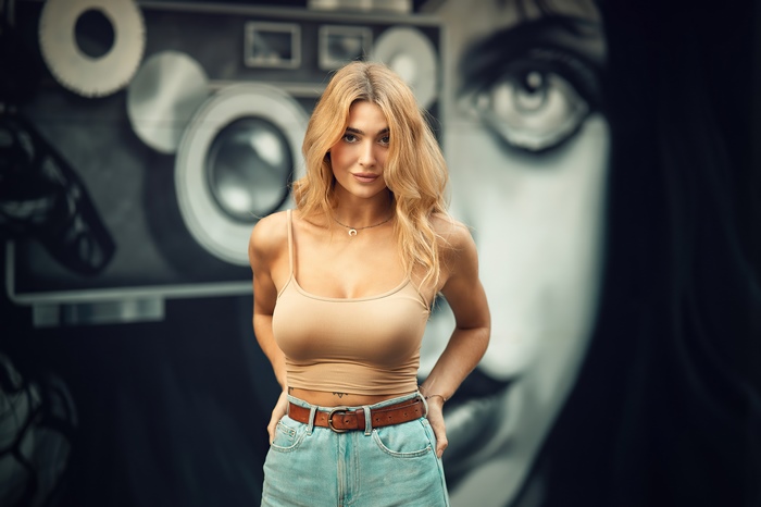 Blonde model in tank top and denim shorts
