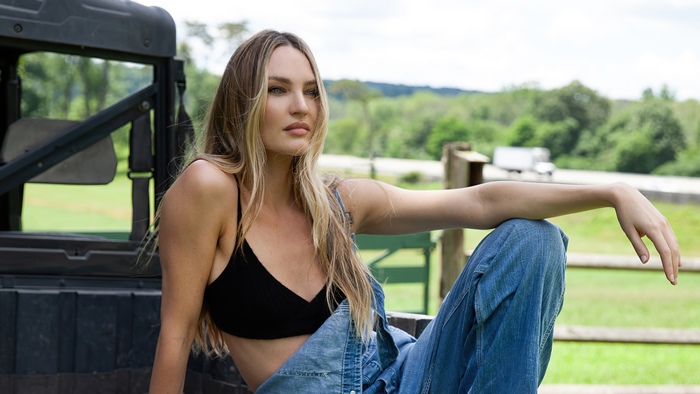 Candice Swanepoel in denim overalls
