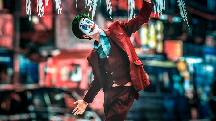 Joker cosplay in a suit with face paint