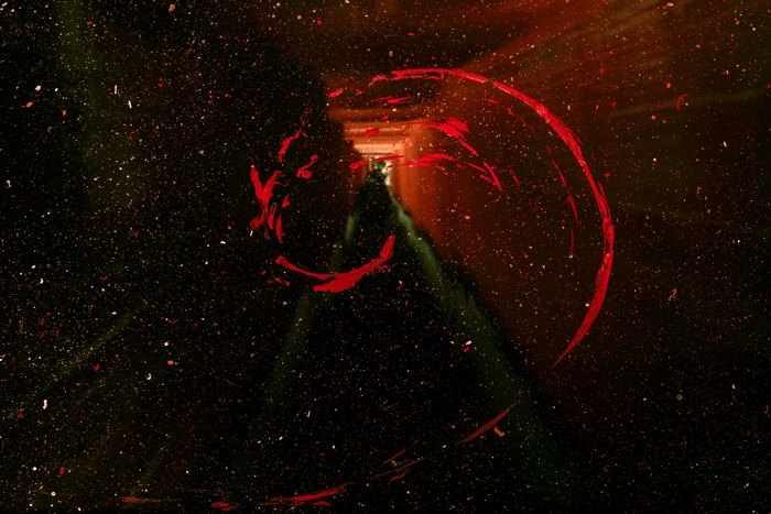 Abstract red paint splash in dark space