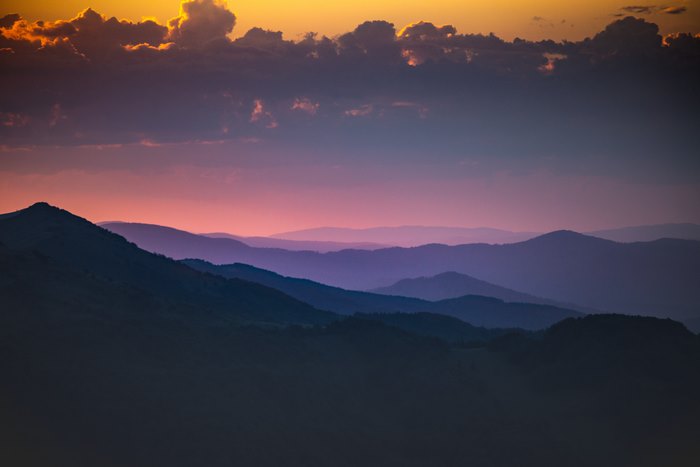 Mountain ranges at sunset with colorful sky