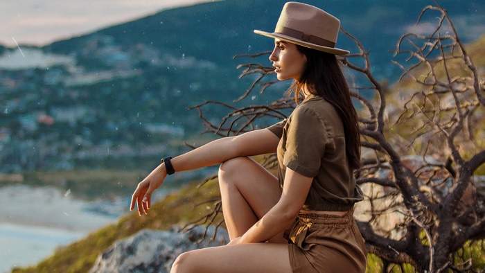 Irina Dreyt in safari outfit on a mountain