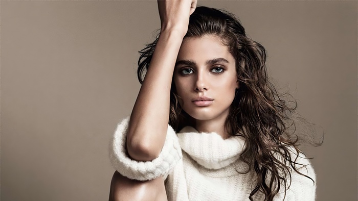 Taylor Hill in a white sweater