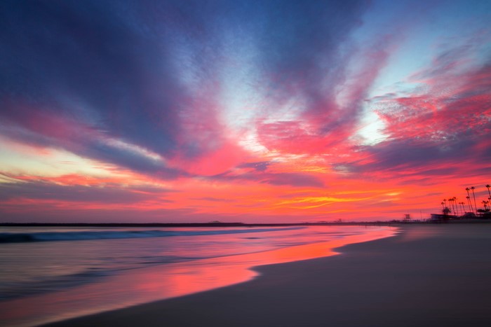 Long exposure beach sunset with colorful clouds