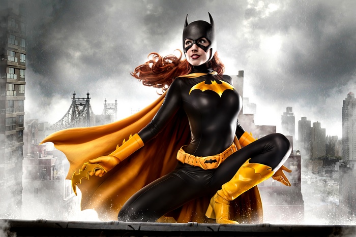 Batgirl in a black and yellow costume on a rooftop