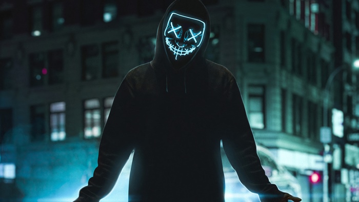 Person in Anonymous mask with neon lights