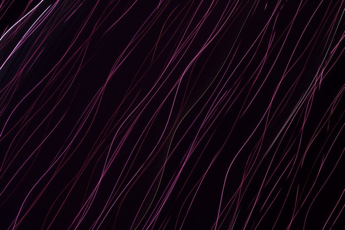 Abstract purple light streaks