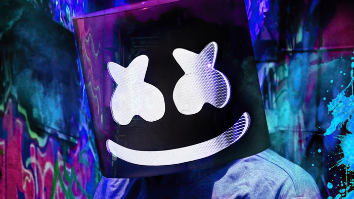 Marshmello wearing his iconic mask in a colorful setting
