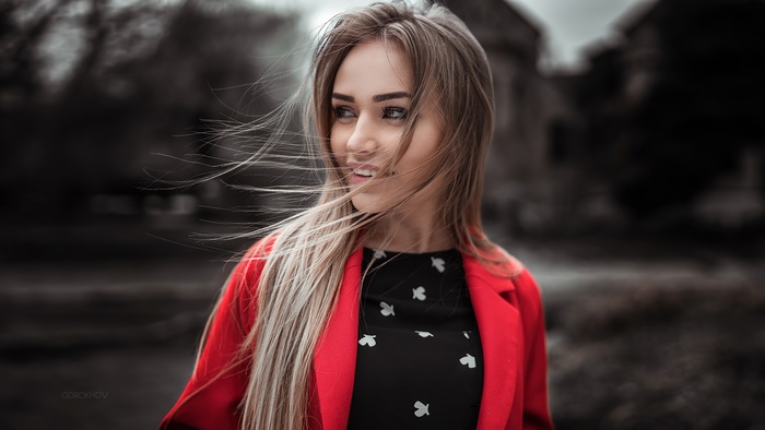 Blonde model in red jacket