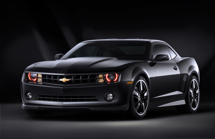 Black Chevrolet Camaro with red halo headlights