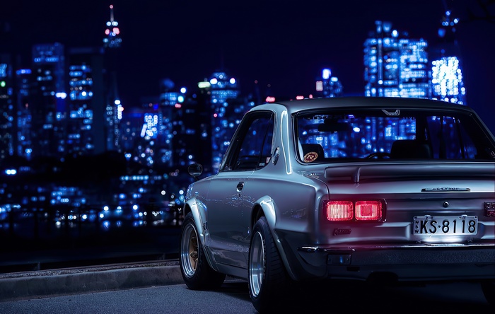 Nissan Skyline parked in a city at night