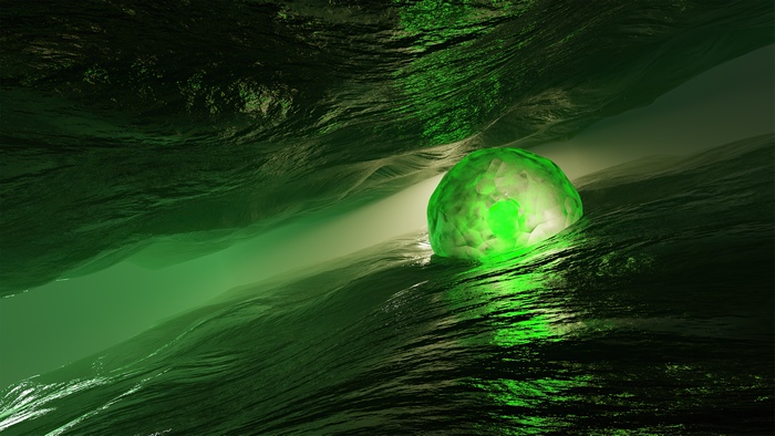 Green glowing orb in a dark, rocky landscape
