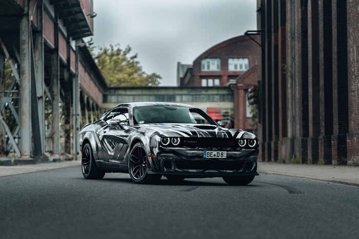 Dodge Challenger with custom graphics in industrial setting