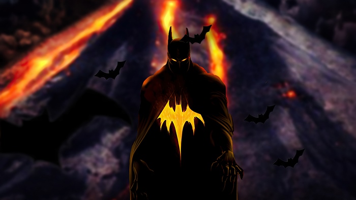 Batman with glowing bat symbol in front of volcano