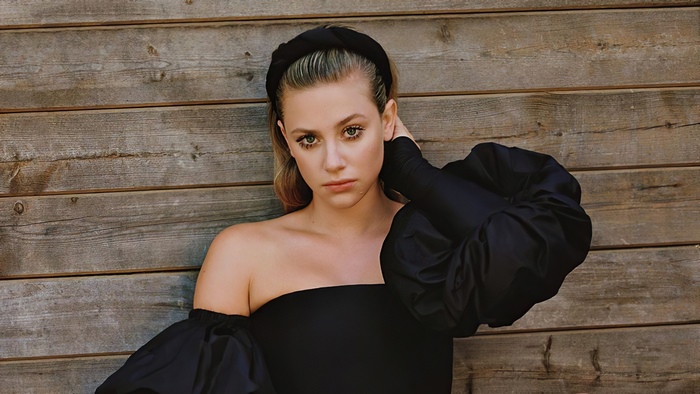 Lili Reinhart in a black off-the-shoulder top and headband