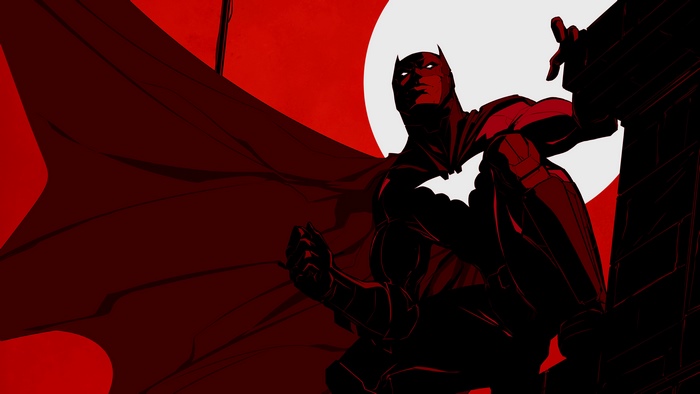 Batman on a building ledge with a large moon behind him