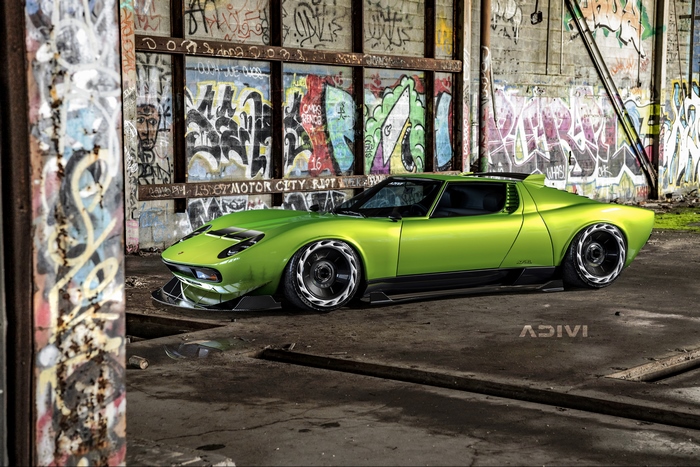 Lime green Lamborghini Miura in graffiti-covered industrial building