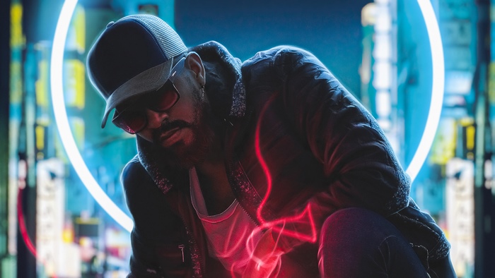 Man in cap and sunglasses with neon lights