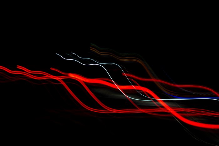 Abstract light trails on black background