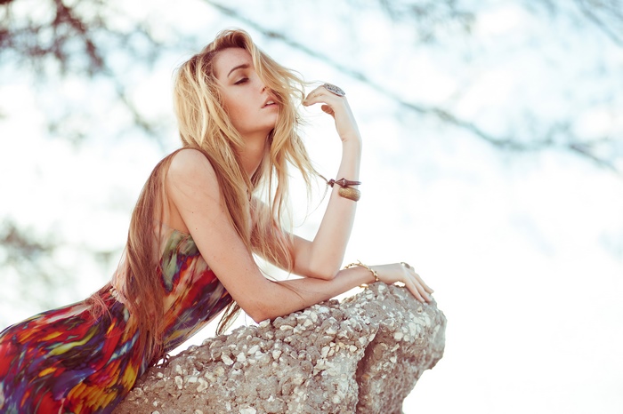 Model in a colorful dress on a rock