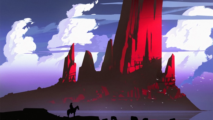 Cowboy on horseback in front of red rock formations