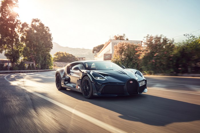 Bugatti Divo driving on a sunny road
