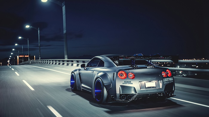 Nissan GT-R on a bridge at night