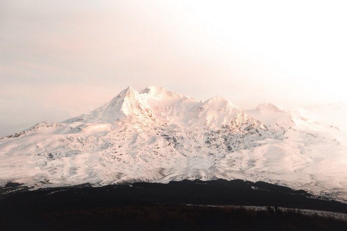 Snow covered mountains in soft light 4K