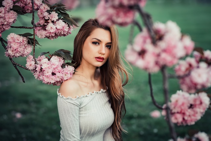 Blonde Model Posing with Pink Blossoms in
