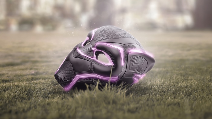 Black Panther mask with purple glowing accents on grass