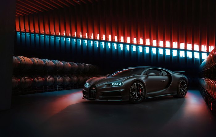 Bugatti Chiron in a dark cellar with barrels