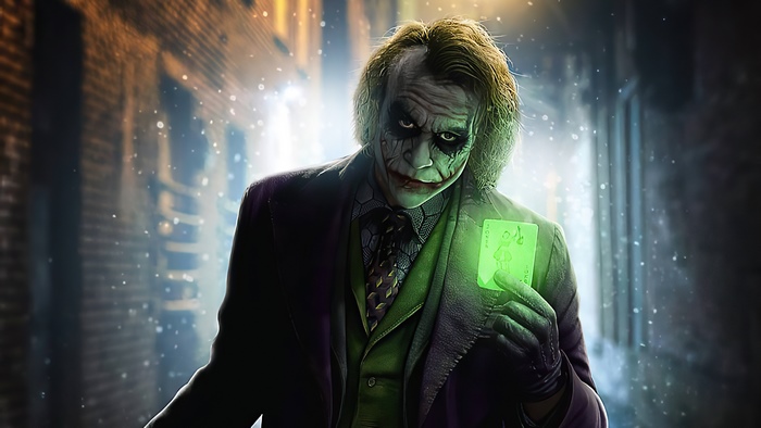 The Joker holding a glowing card 4K