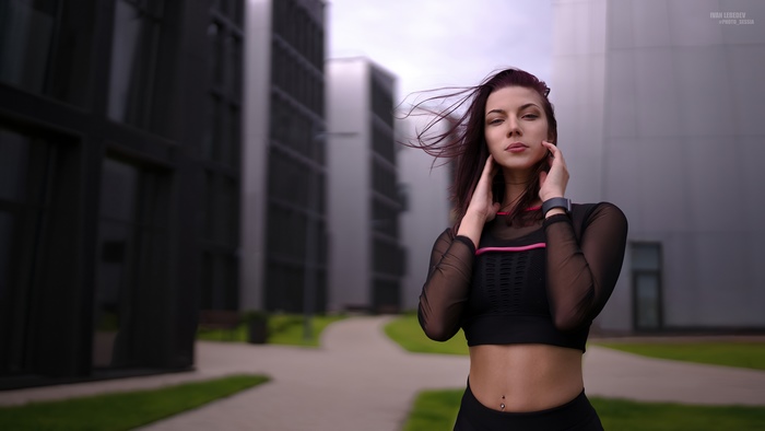 Woman in athletic wear standing outdoors