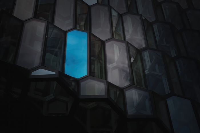 Abstract building facade with blue window