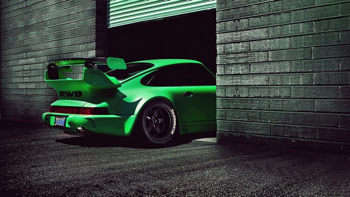 Green RWB Porsche 911 exiting garage