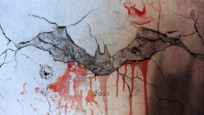 The Batman logo with blood and cracks 2021